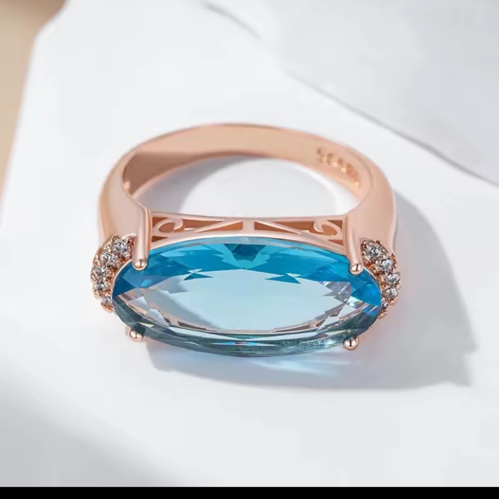 Rose Gold Ring with Aquamarine Blue Oval Gemstone